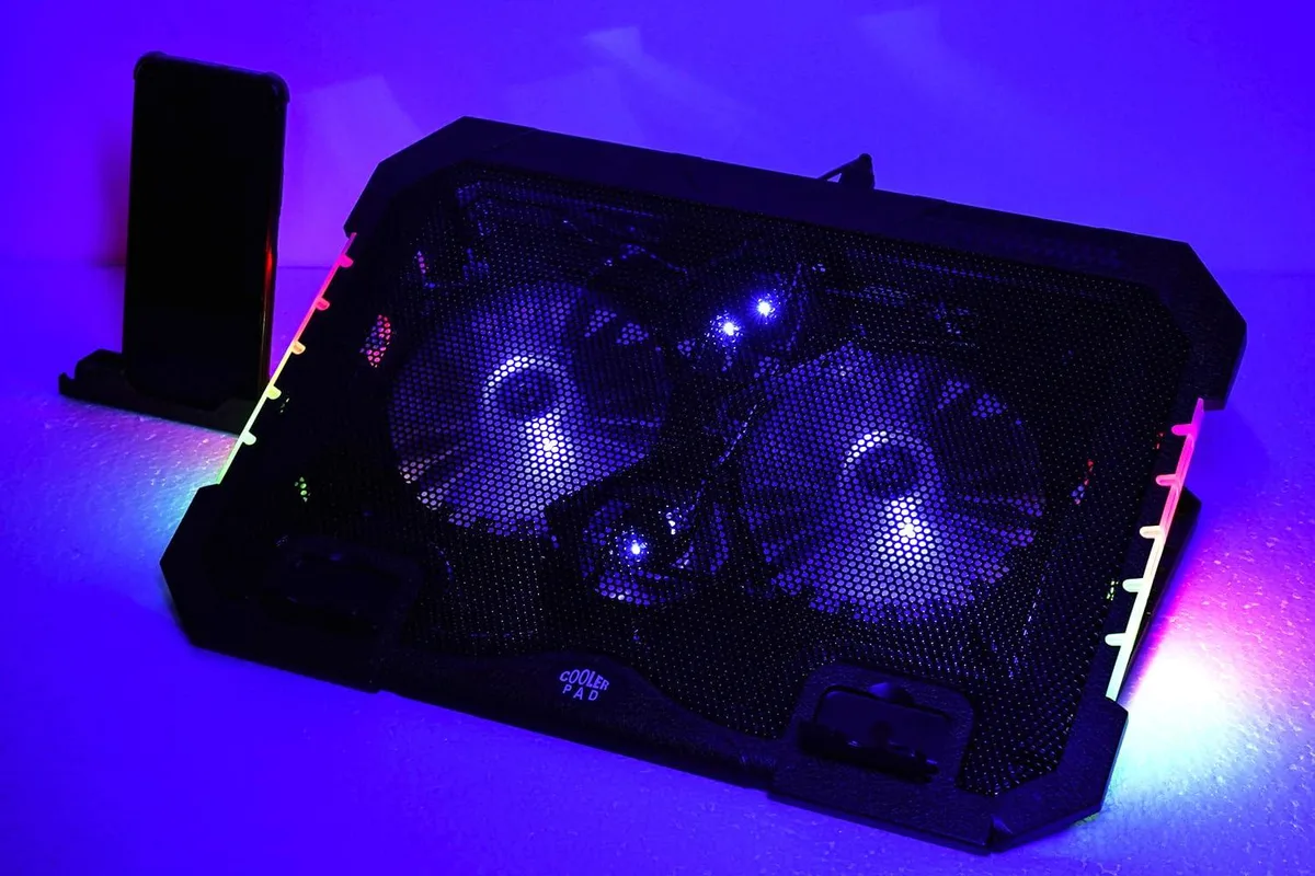 Rectangular black laptop cooler with four fans and RGB side lighting