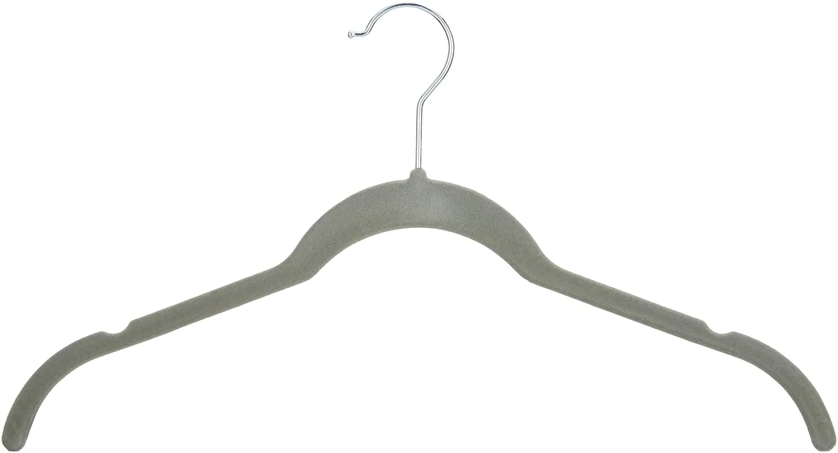Thirty slim gray velvet hangers with silver hooks, neatly stacked