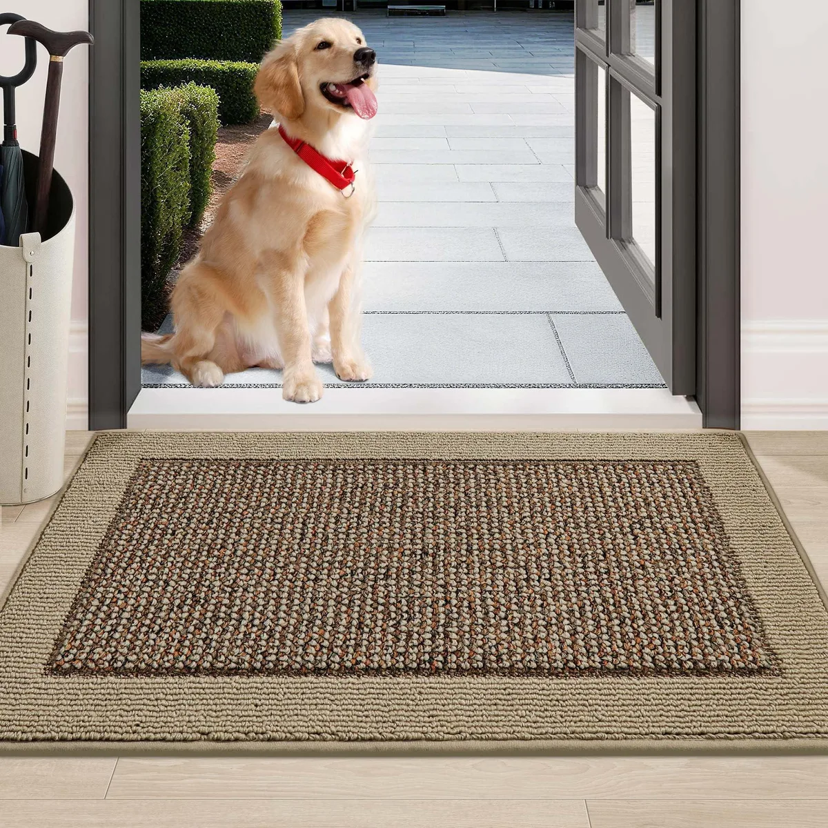 Rectangular taupe door mat with low-profile woven surface and dark non-slip backing