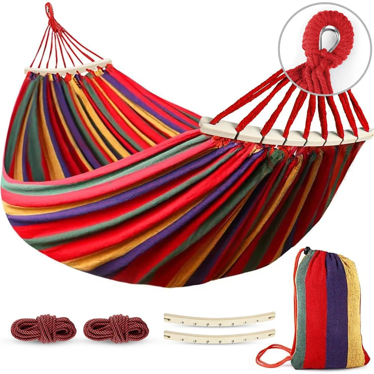 Colourful striped canvas hammock with spreader bars and tree straps in carry bag