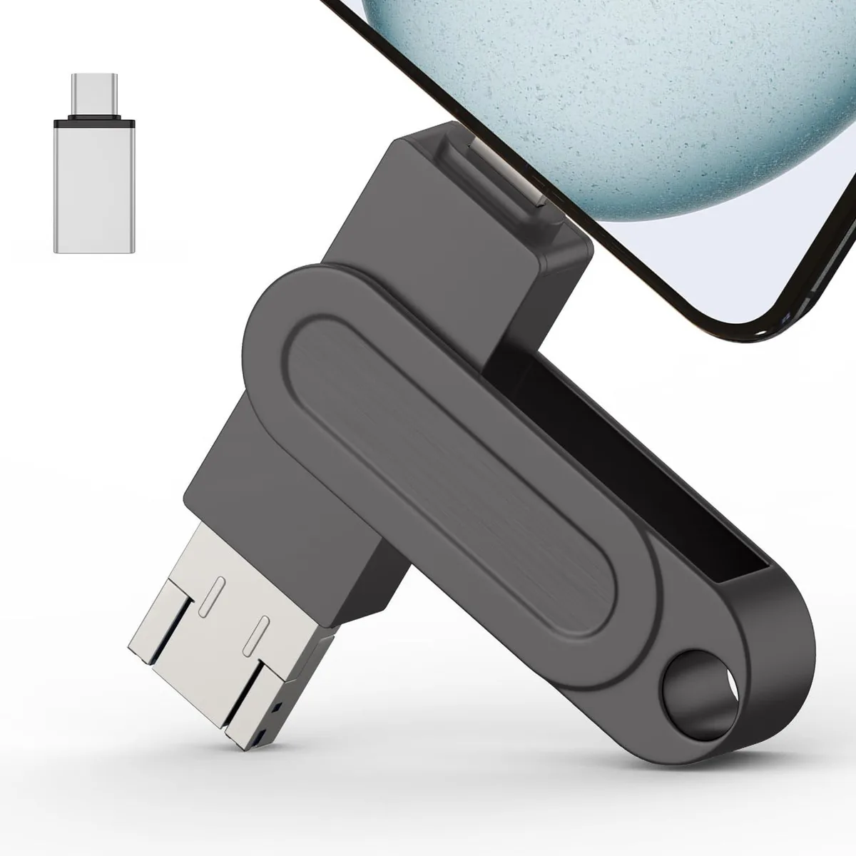 A small rectangular flash drive with a glossy finish and multiple connector tips visible