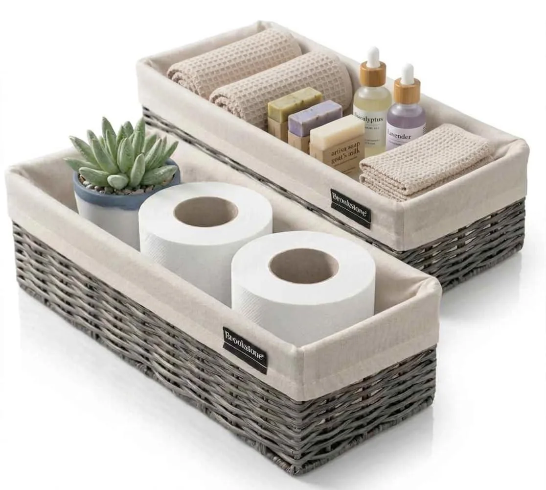 Two grey handwoven storage baskets with fabric liners