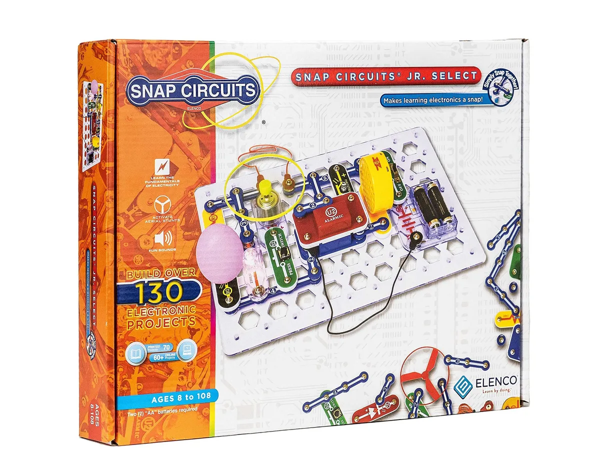 Colourful plastic electronics kit with snap-together parts on a grid base