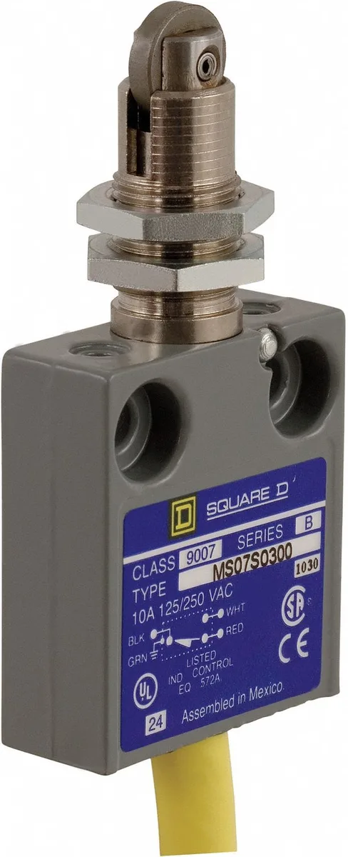 Compact rectangular switch with roller plunger actuator on top, matte grey finish
