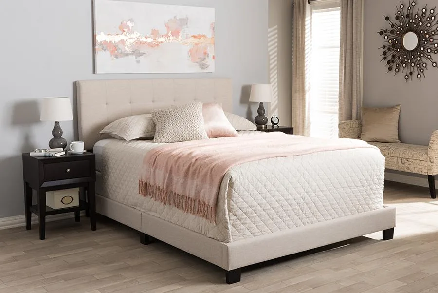 Beige fabric upholstered queen bed with grid-tufted headboard and black legs