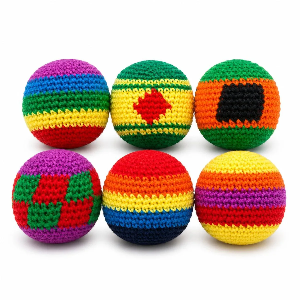 Twelve small cotton footbags in assorted bright colours, each about 2.5 inches across, soft crochet finish, loose in a pile