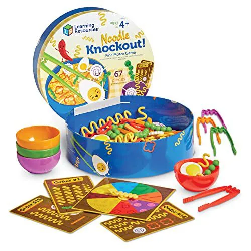 A plastic bowl containing colourful noodles, toppings, chopsticks and order cards