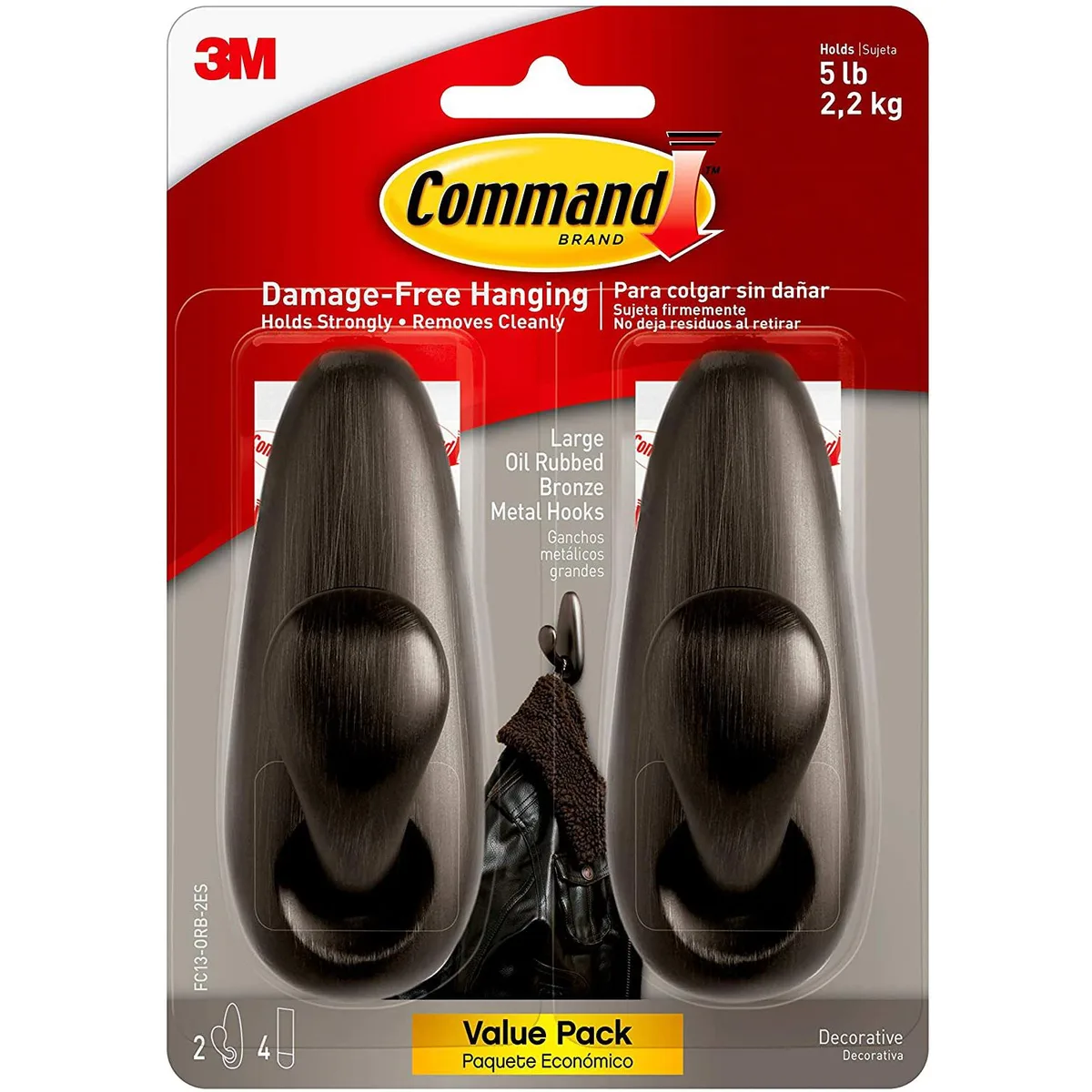 Two bronze metal hooks with adhesive strips