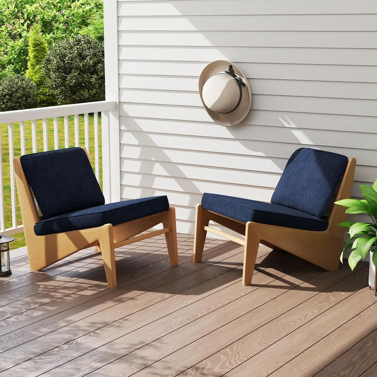 Two navy outdoor seat cushions with matching back pillows, square corners, removable covers