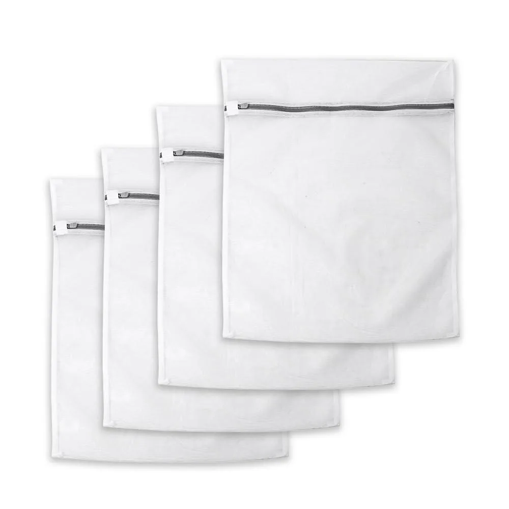 Four beige mesh laundry bags with zipper closures laid flat