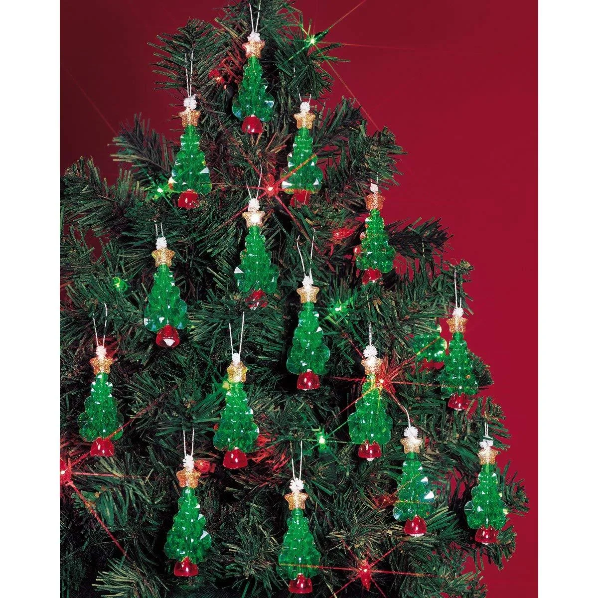 Clear box with beads, wire and tiny green tree forms for 24 ornaments
