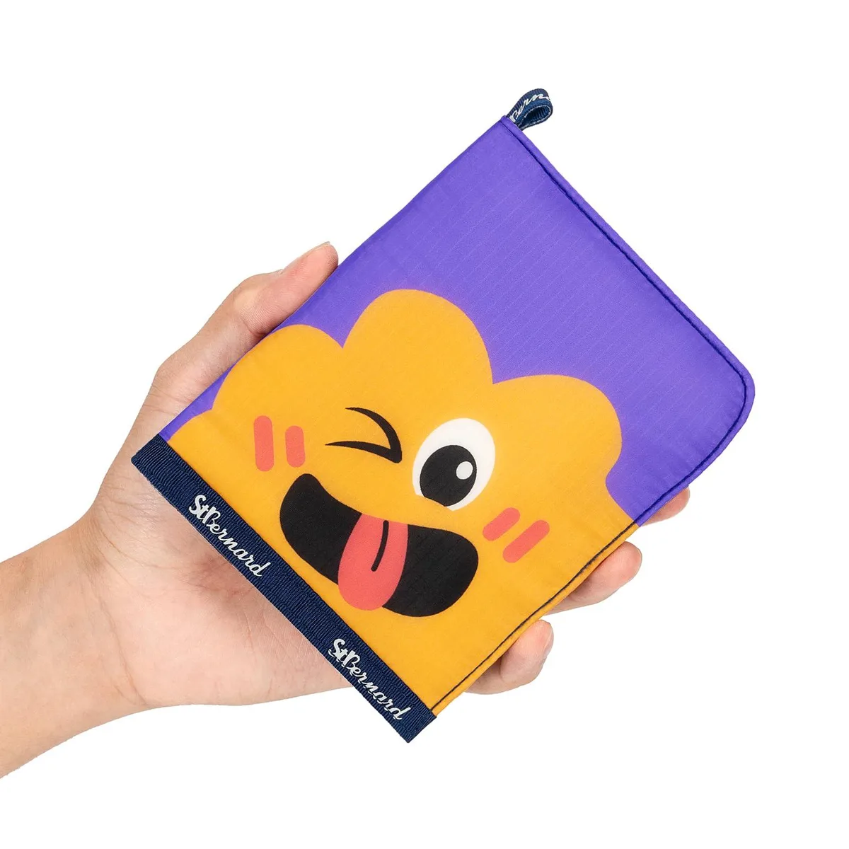 Purple wallet-style first aid kit folded open showing organised compartments and cartoon bandages