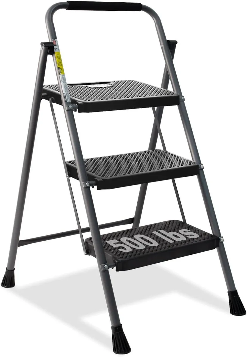 Grey three-step steel folding ladder with wide anti-slip treads and rubber handgrip