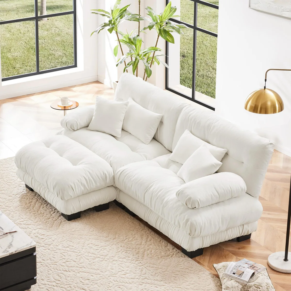 White chenille 2-seater sectional with wide rounded arms, convertible ottoman and four pillows