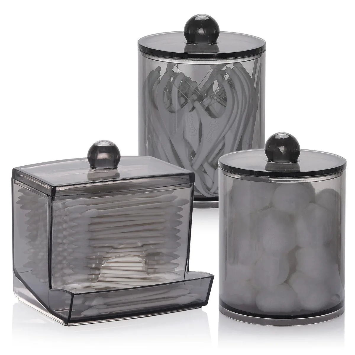 Three black glossy plastic bathroom jars, one taller q-tip dispenser and two round cotton ball holders