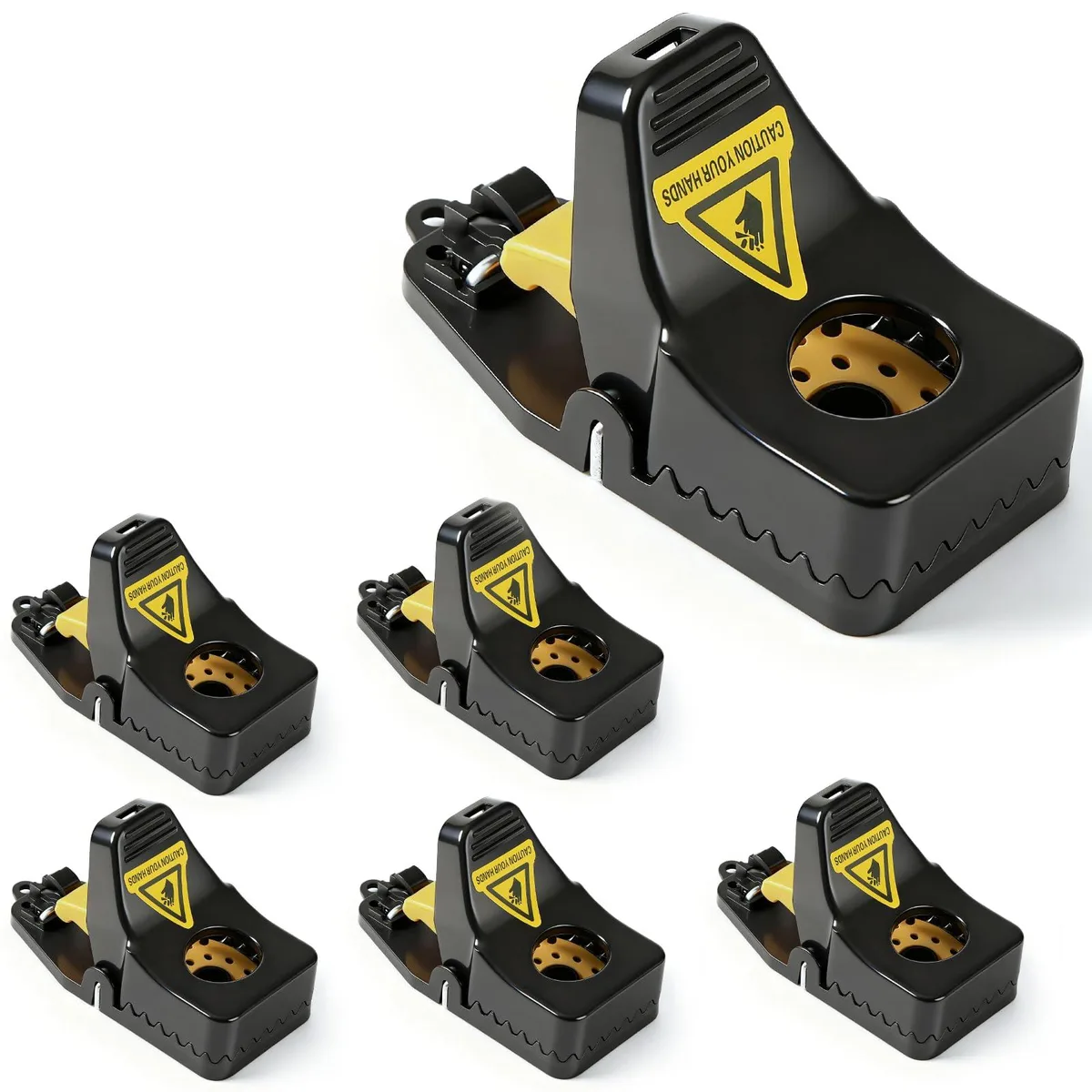 Six white plastic snap mouse traps with yellow triggers on a light surface