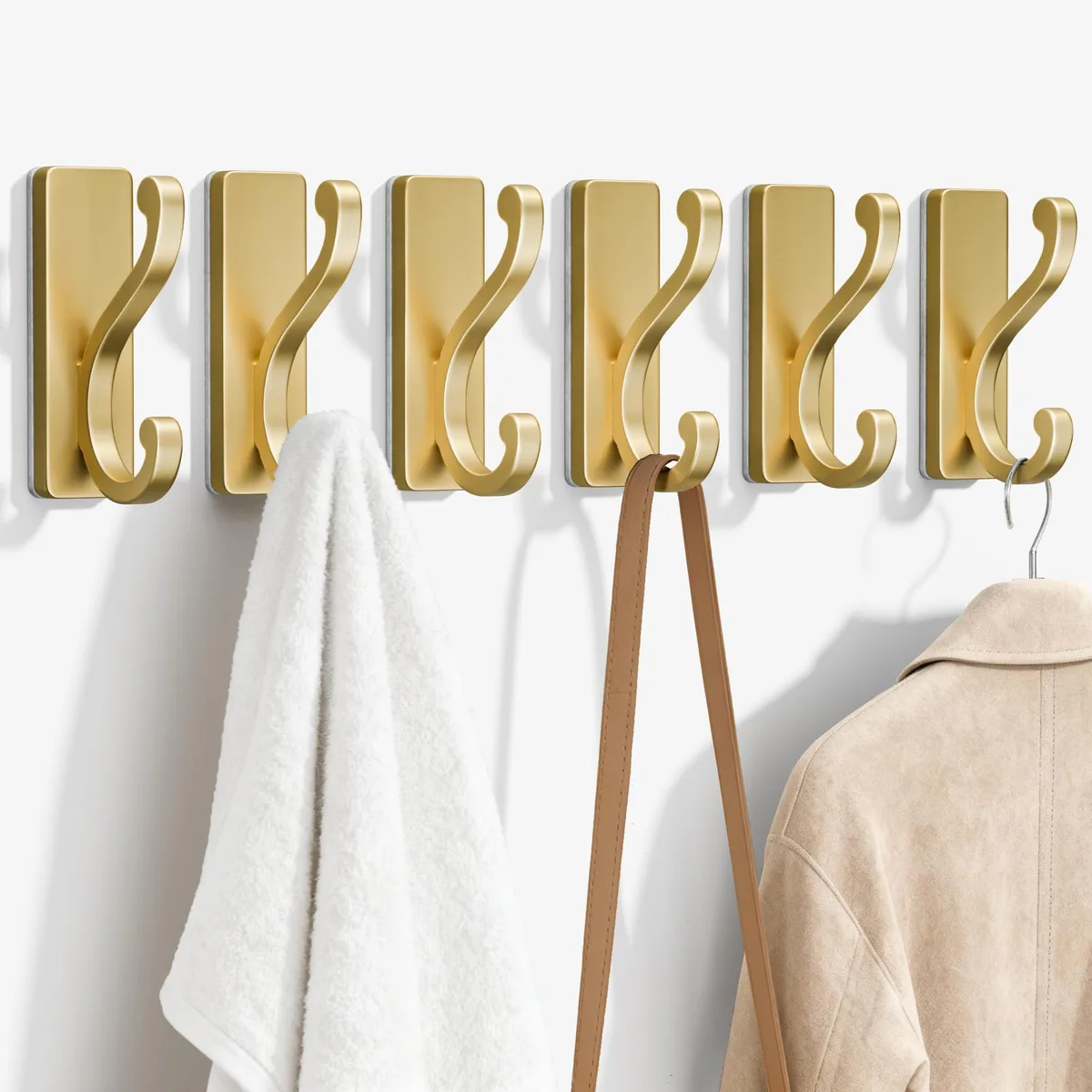 Gold self-adhesive coat hooks, smooth metal finish
