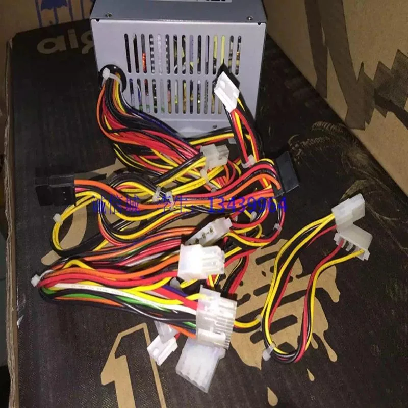 A plain black ATX power supply unit with a metal casing and cooling fan visible on one side