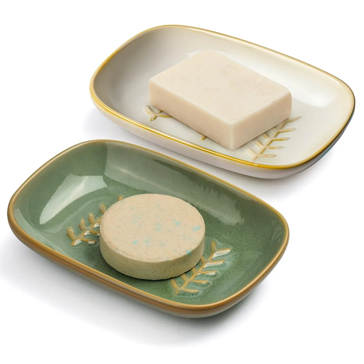 Two square white ceramic soap dishes with green glaze and raised drainage pattern