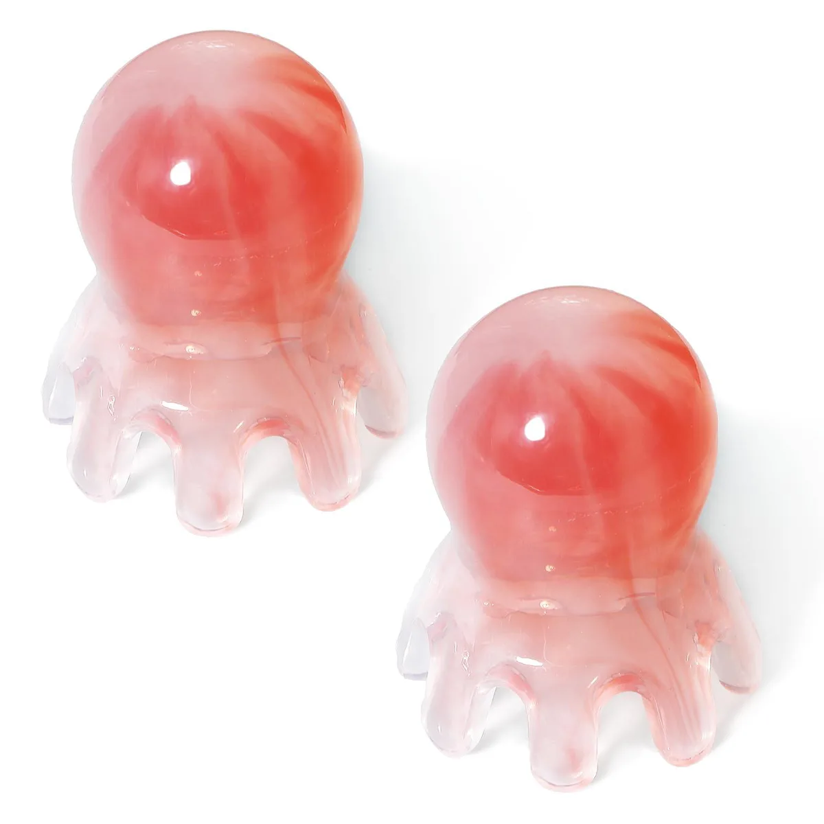 Two pink resin octopus scalp massagers, 1.8 by 2.2 inches each