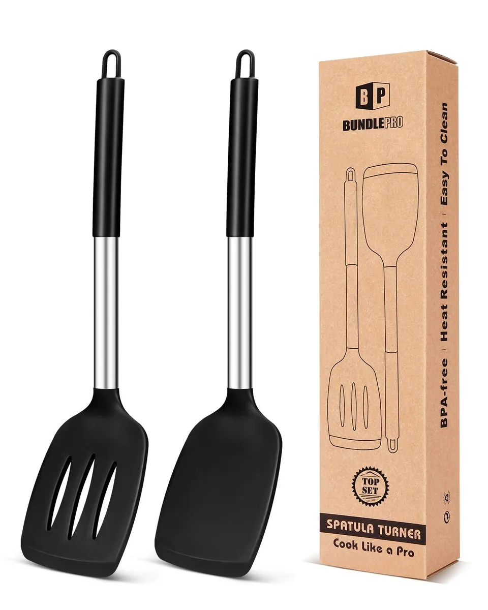 Two black silicone turners with stainless steel handles and hanging holes