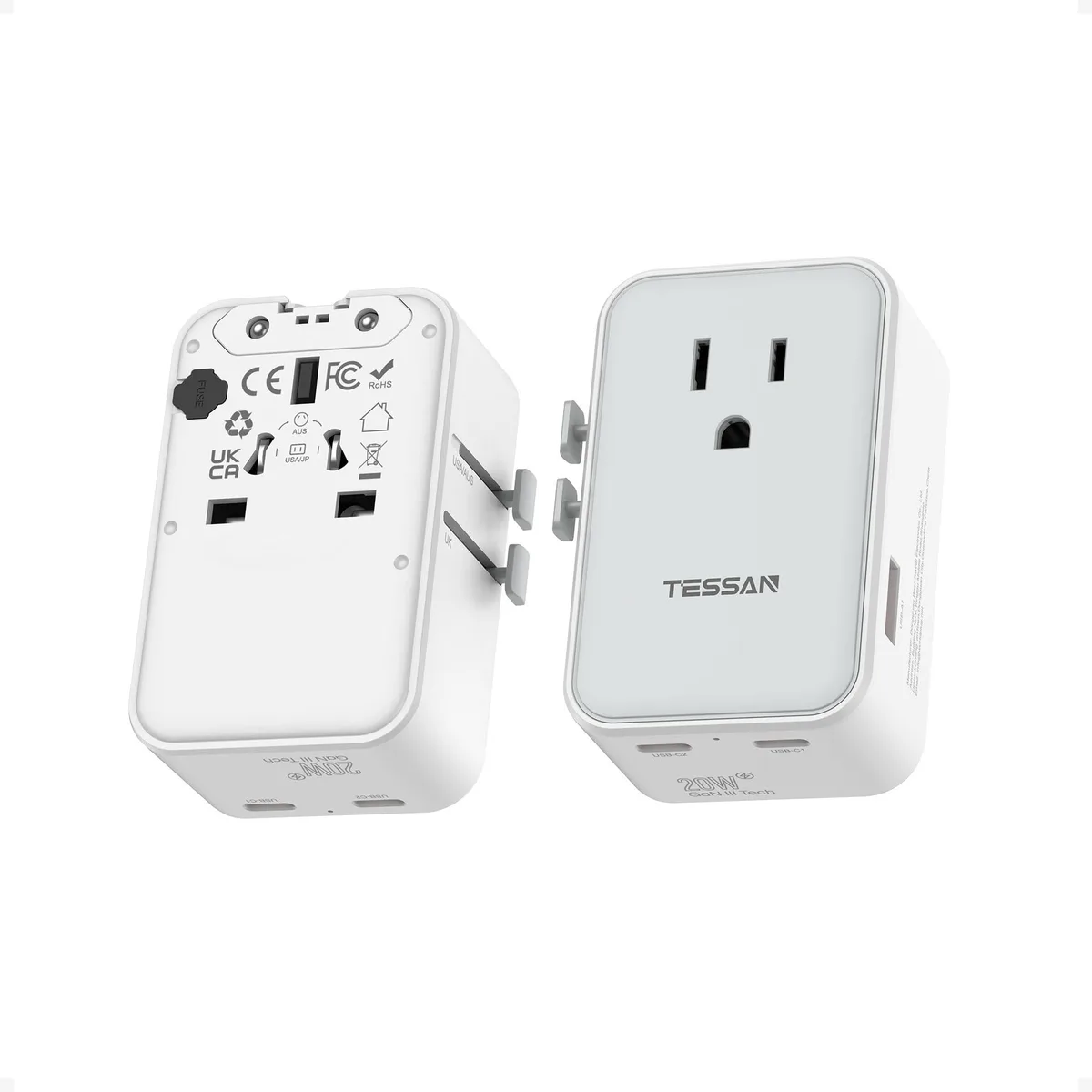 White rectangular travel adapter with sliding plug pins, two USB-C ports, one USB-A port, and an AC outlet