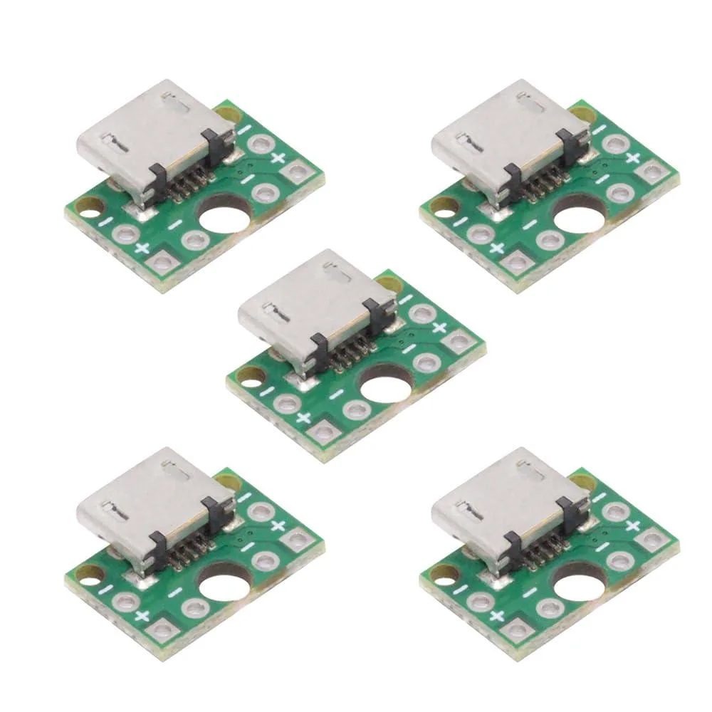 Five small silver USB Micro-B sockets on green circuit boards