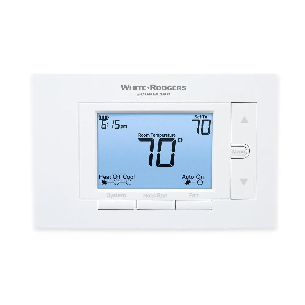 White rectangular wall thermostat with large backlit display and keypad controls