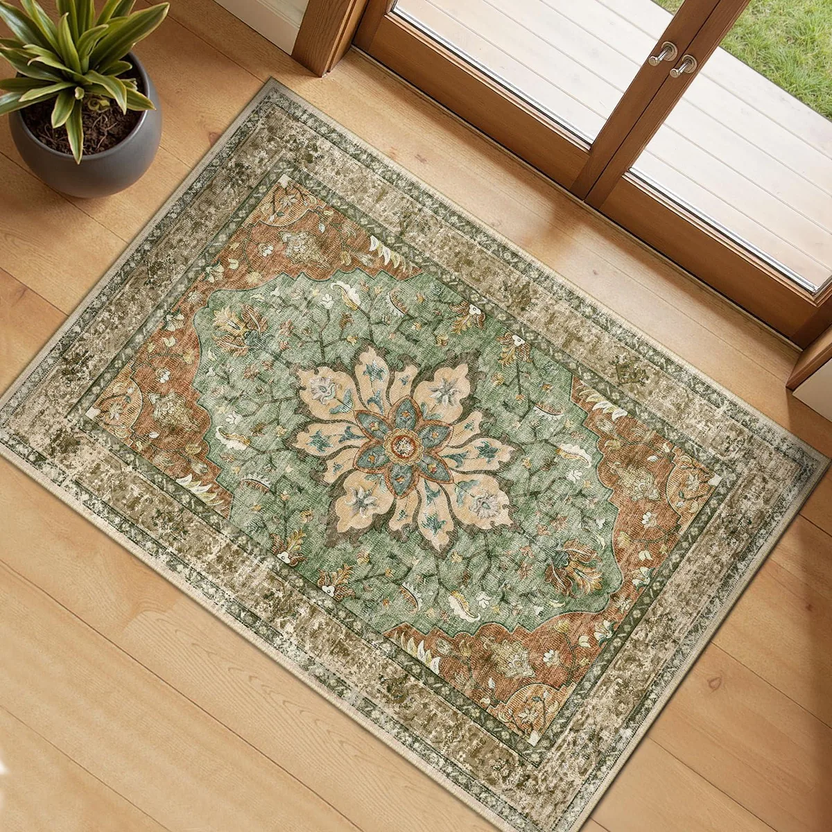 Rectangular washable rug in brick brown and green with vintage floral pattern, low pile, non-slip backing
