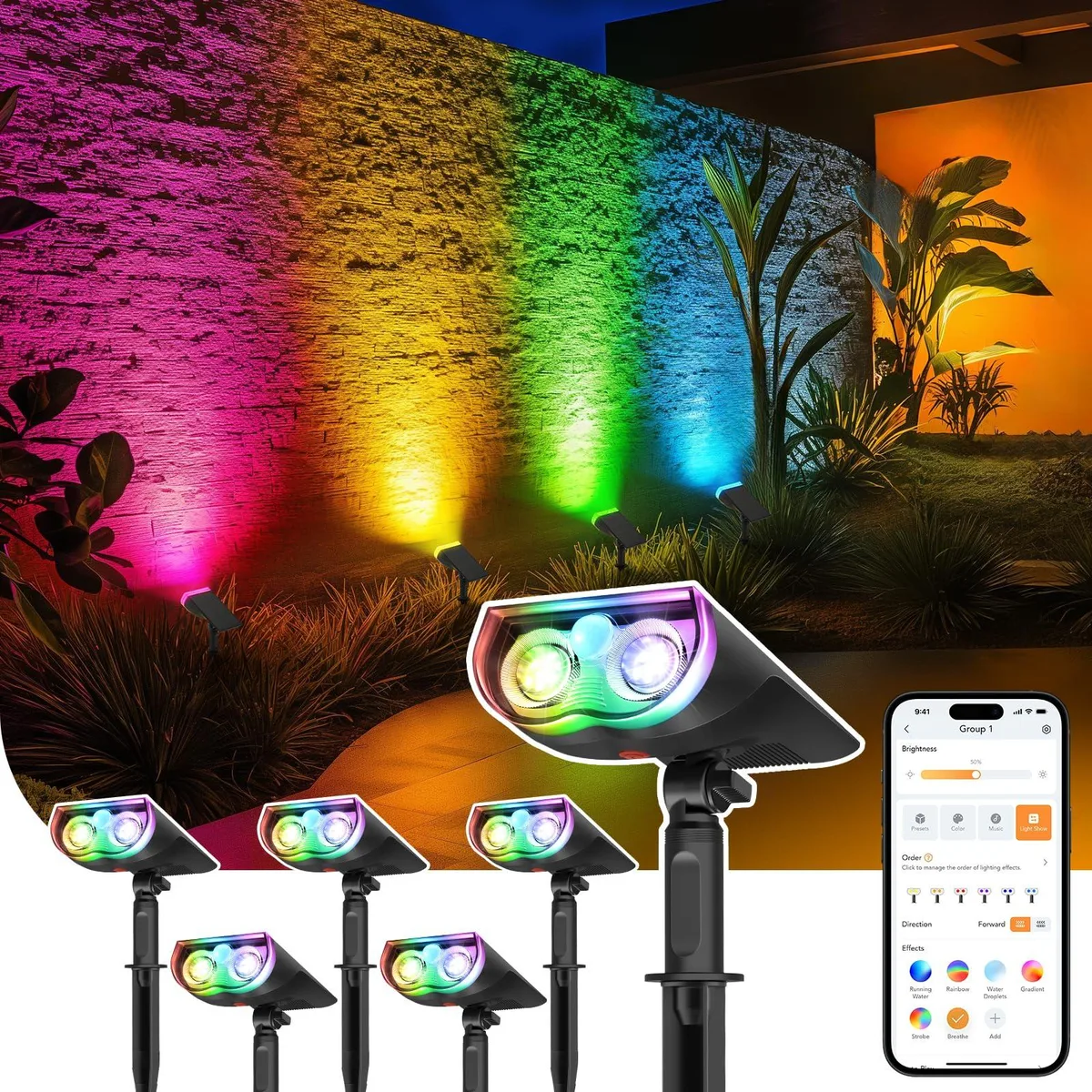 Six black resin spotlights with integrated solar panels, ground stakes attached