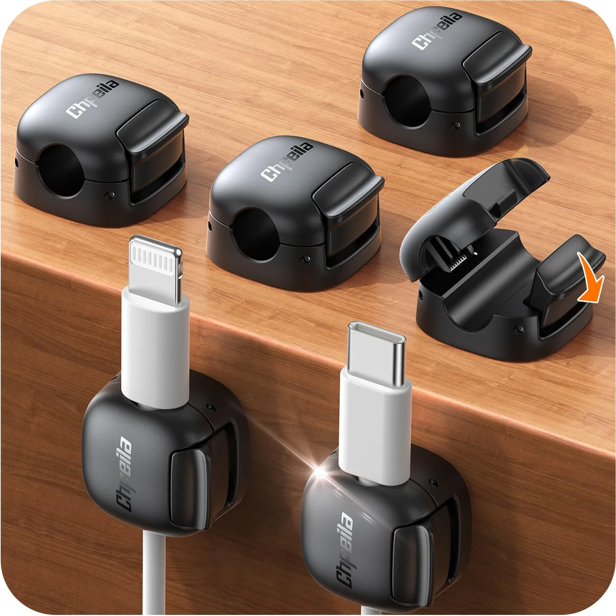 Six small square black cord clips with adhesive backs