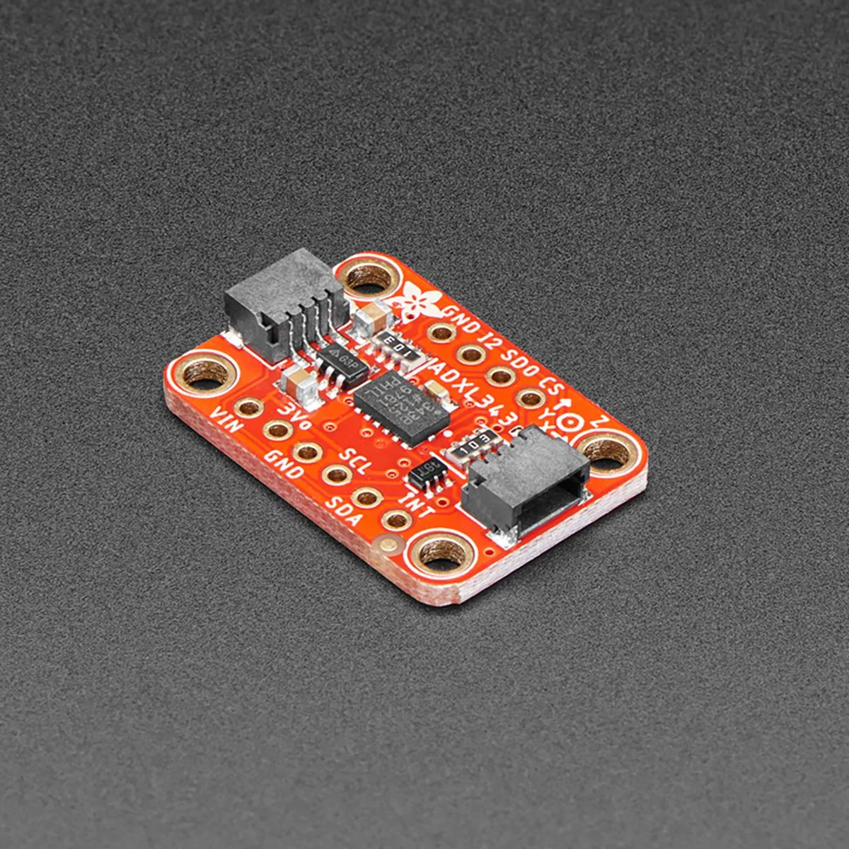 Small green circuit board with sensor chip and four-pin connector