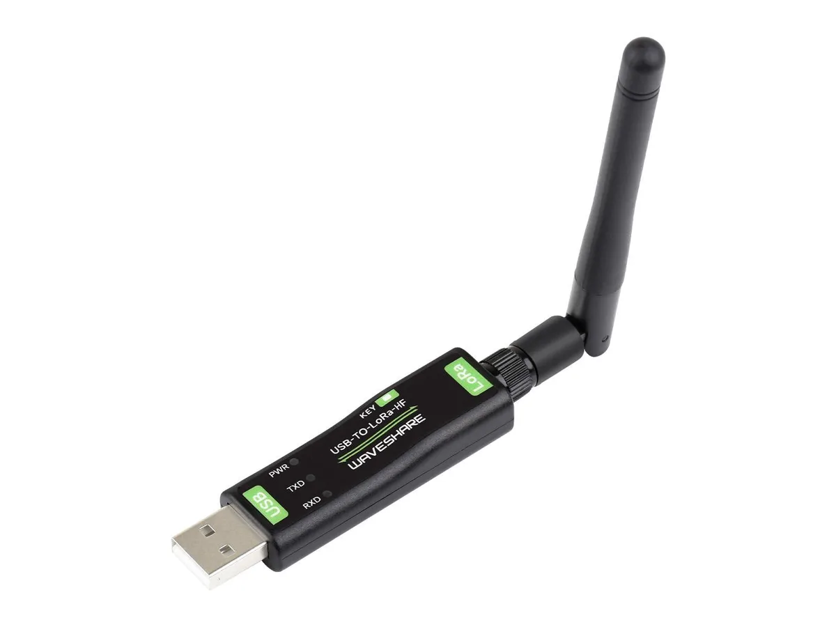 Small green USB stick with a PCB antenna and TCXO crystal