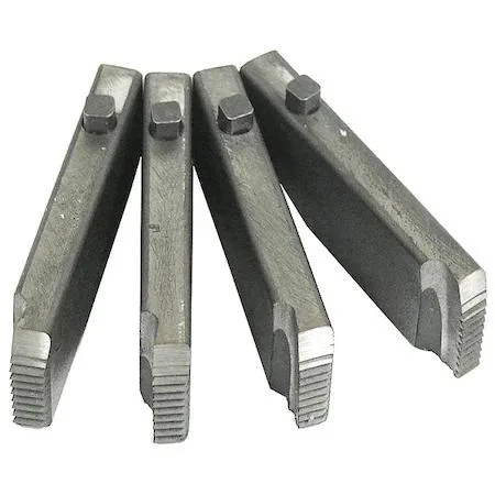 Set of four silver steel pipe threading dies in a row