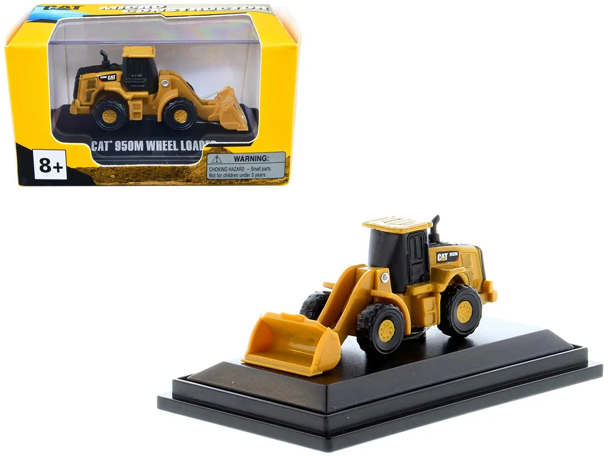 Yellow CAT 950M wheel loader diecast model with movable boom, detailed interior and exterior, in clear acrylic display case
