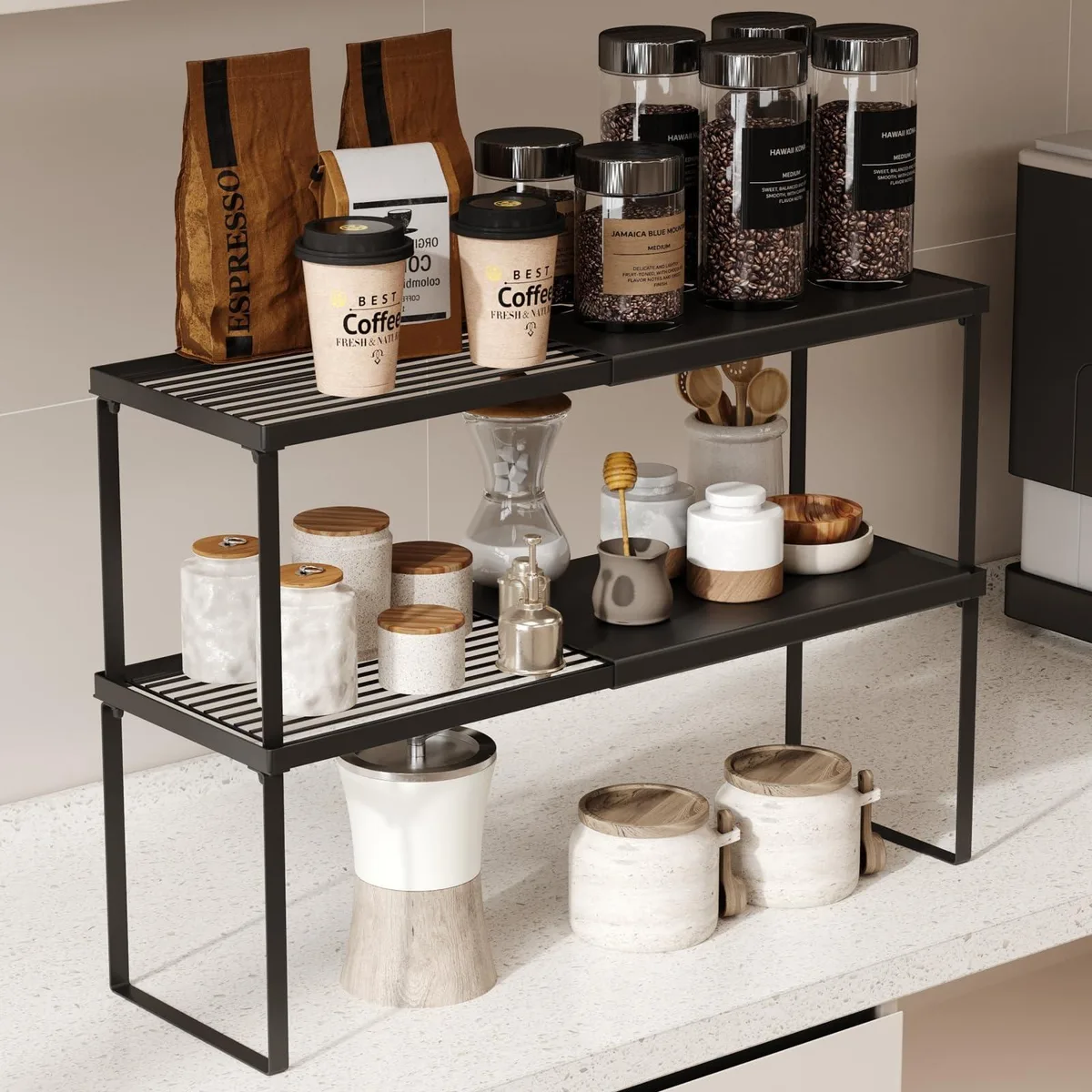 Two red expandable plastic shelves, round shape, stacked two-tier on countertop