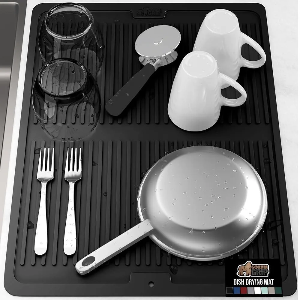 Black rectangular silicone mat with raised ribbed surface and edges, 18 by 24 inches