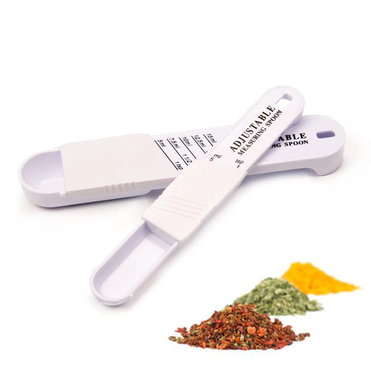 Two adjustable plastic measuring spoons with sliding scales marked in teaspoons and millilitres