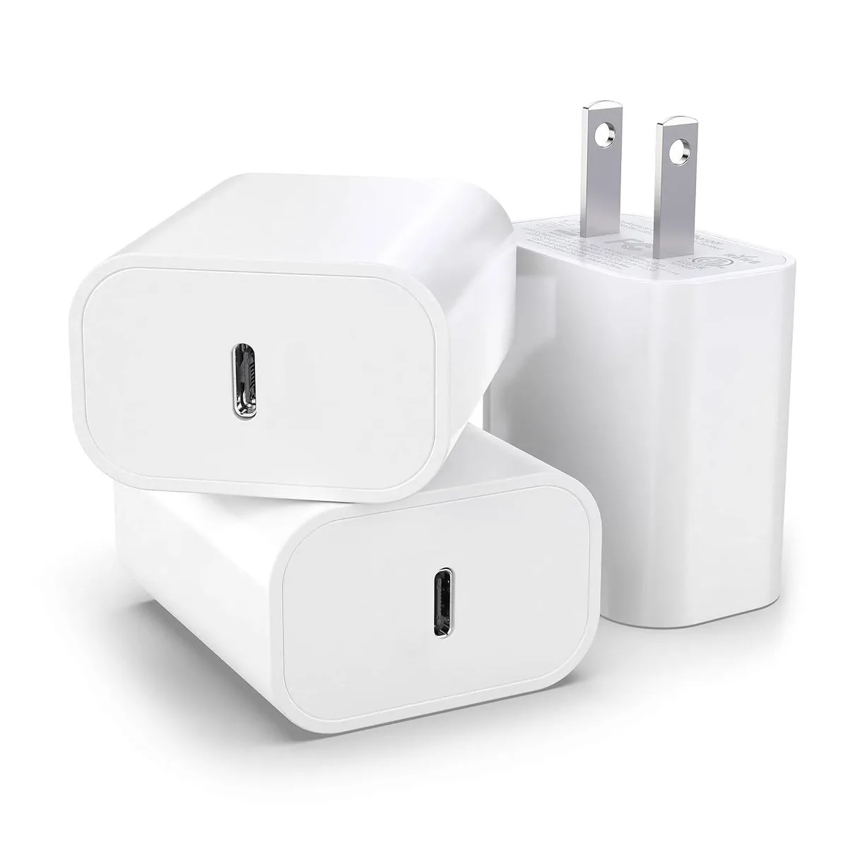 Three compact white USB-C wall chargers with folding prongs