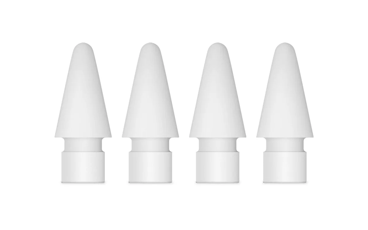 Four white plastic Apple Pencil tips in a small pack
