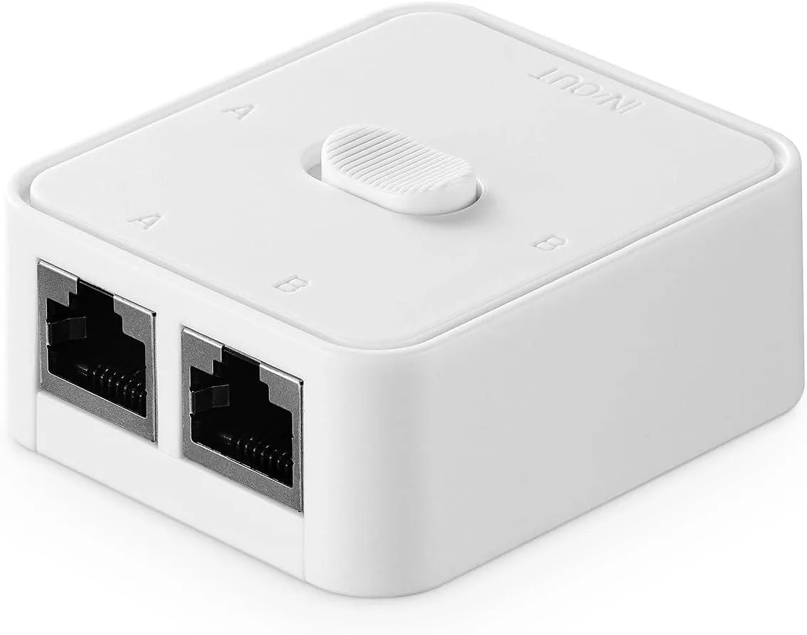 Small black desktop network switch with three RJ45 ports and a selector switch