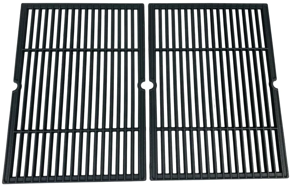 Two dark cast iron grill grids with interlocking edges