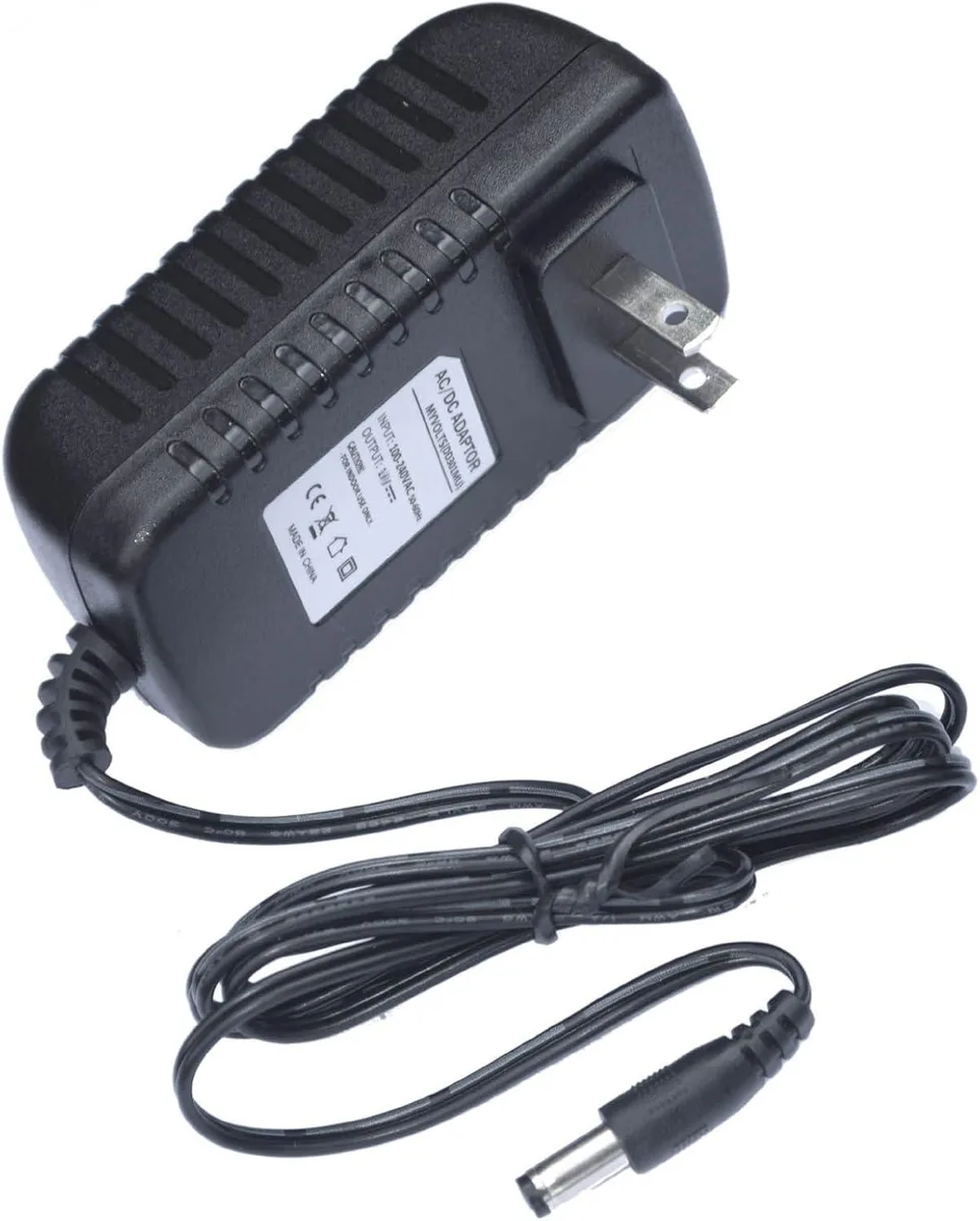 Compact black 9V power adapter with US two-pin plug and barrel connector
