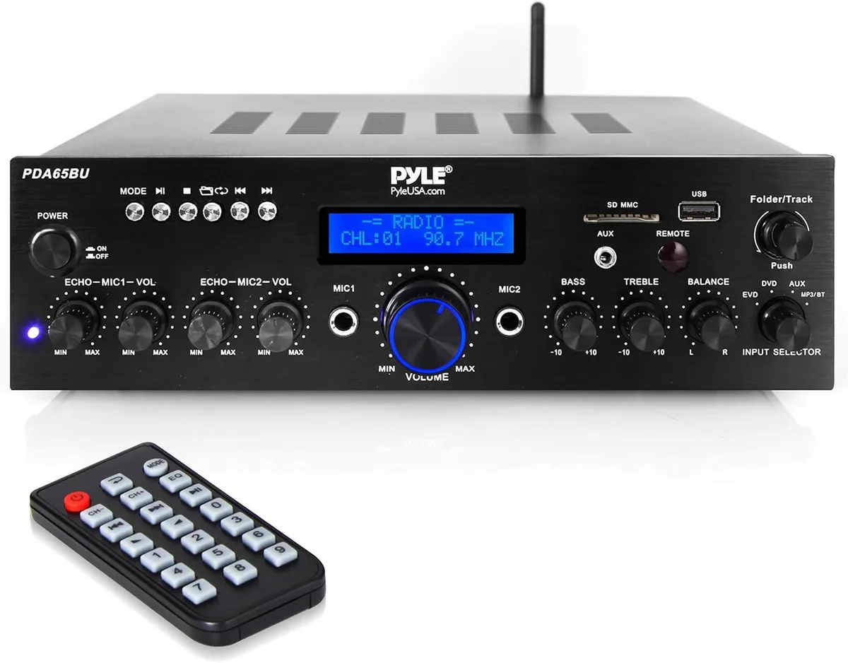 Black stereo receiver with front-panel knobs, LCD display, USB and SD slots, microphone inputs, and RCA connections