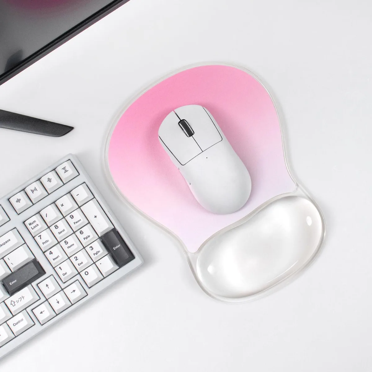 Rectangular gel mouse pad in gradient pink with clear wrist rest, non-slip base