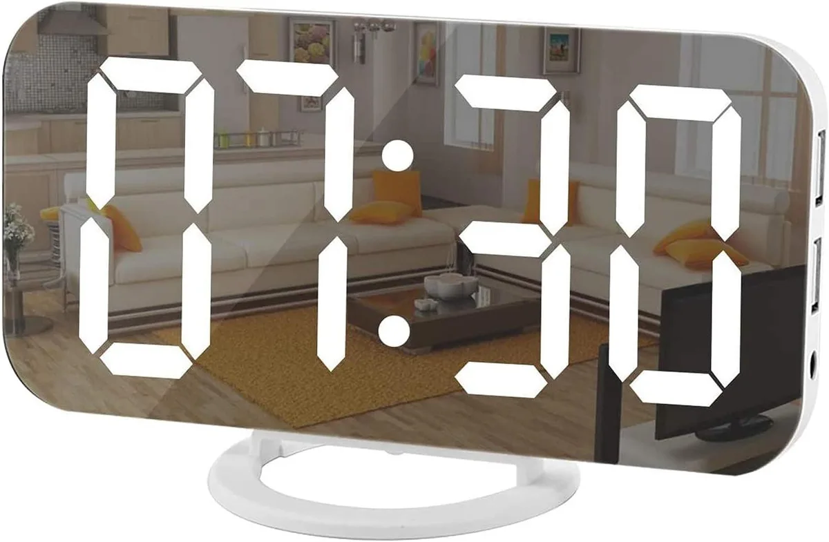 Rectangular white LED clock with mirror face showing 12-hour time