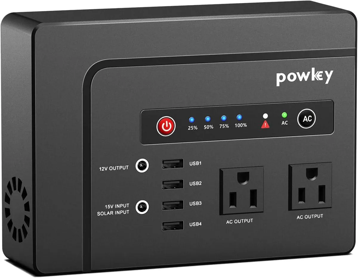 Compact rectangular power station with carrying handle, matte finish, AC USB DC ports visible