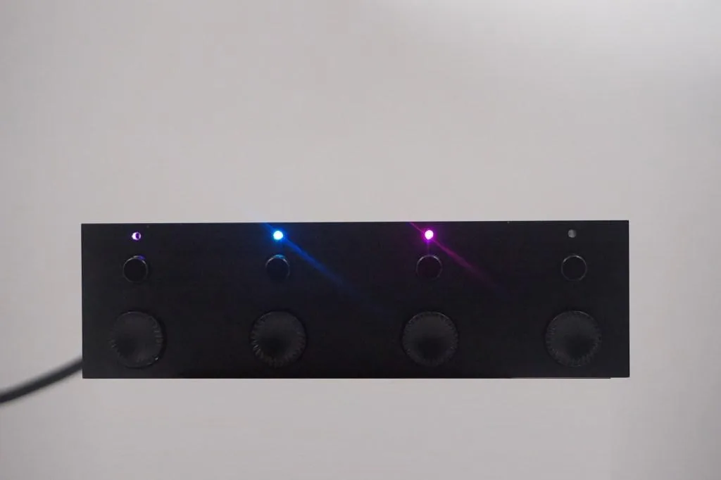 Black rectangular controller unit with multiple ports and indicator lights