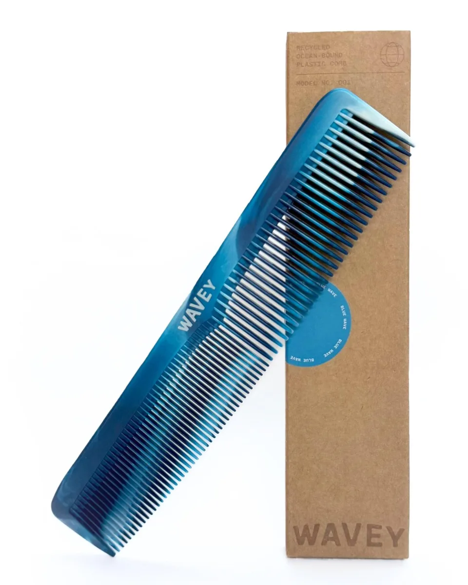Blue plastic hair comb with wide and fine teeth, 7 inches long, made from recycled ocean-bound plastic