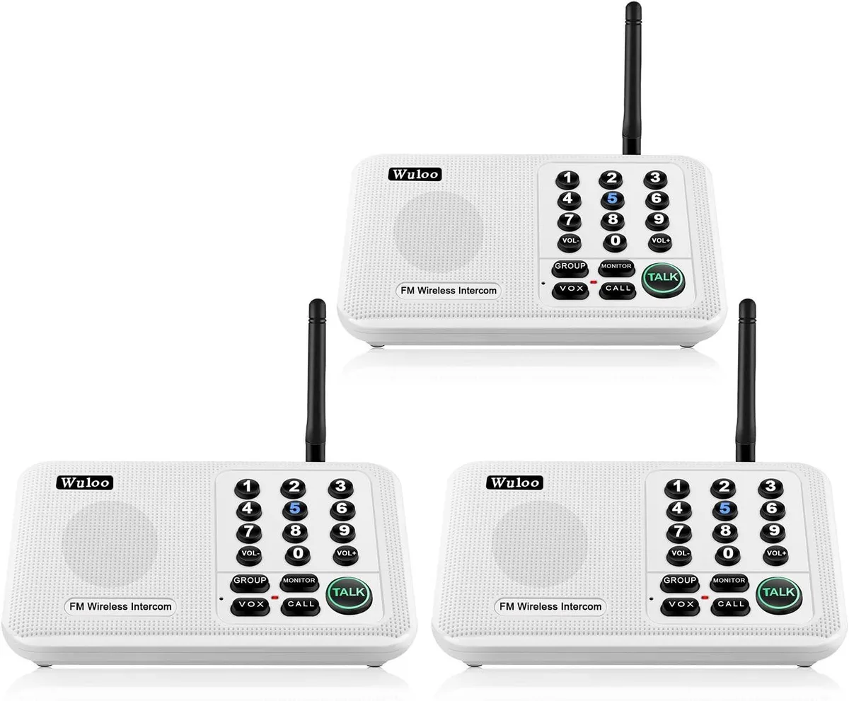 Three white wireless intercom units in a row